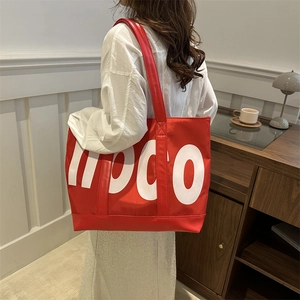 Large capacity red tote bag with IPCO lettering and wide shoulder strap for women