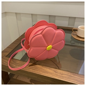 Close-up of a pink floral PU leather crossbody bag with a yellow flower bud accent