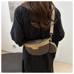 Back view of model wearing a vintage brown monogram chest bag with a small round pouch