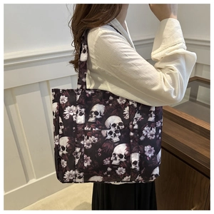 Gothic skull and flower print tote bag on shoulder, stylish lightweight nylon handbag