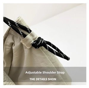 Close-up of the adjustable shoulder strap with black and white braided rope detail
