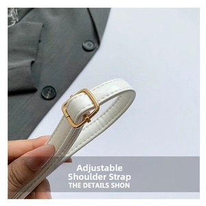 Detail of adjustable white litchi pattern leather strap with gold metal buckle