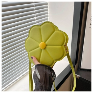 Detail view of a green floral crossbody bag featuring a six-petal design and PU leather texture
