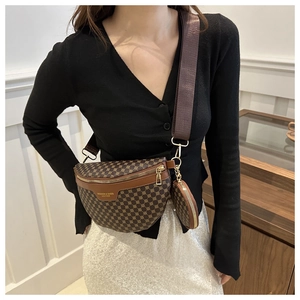 Detail of trendy dark brown monogram fanny pack with matching round coin purse on model