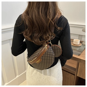 Detailed view of brown vintage waist bag with geometric texture and small round pouch