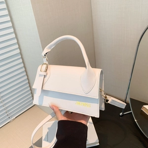 Minimalist beige crossbody handbag with top handle and gold-tone hardware details