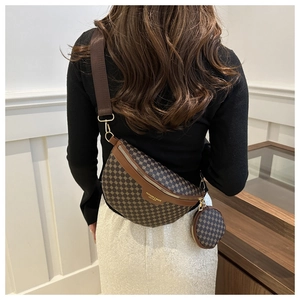 Detail of a two-in-one waist bag with geometric pattern and adjustable wide fabric strap