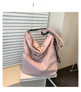Pink large-capacity nylon tote bag with patterned rope shoulder strap and side pocket