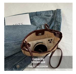 Detailed internal view of handmade straw crossbody bag showing storage capacity