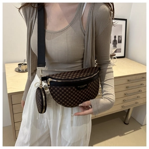 Detail of vintage brown leather waist bag with mini round pouch and adjustable strap