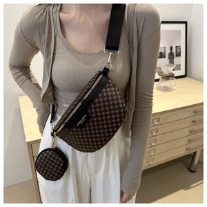 Detail of a brown geometric pattern fanny pack with a mini pouch and nylon strap