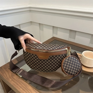 Brown monogram fanny pack with round coin purse and wide shoulder strap in casual setting