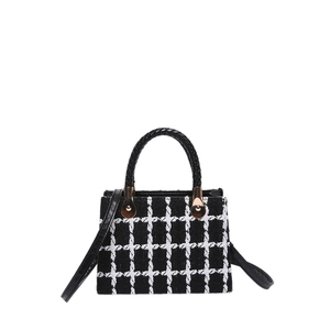 Chic black and white tweed plaid crossbody bag with gold hardware and top handle