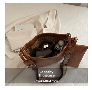 Detail view of large brown vintage tote bag showing spacious interior with multiple pockets