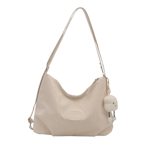 Large cream hobo backpack in textured faux leather with adjustable strap and cloud charm