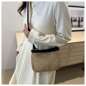 Chic woven straw crossbody bag with black leather trim and strap for women's summer fashion