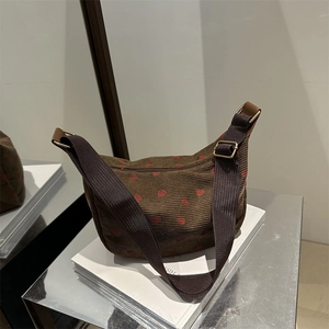 Brown corduroy shoulder bag with red strawberry print and adjustable strap