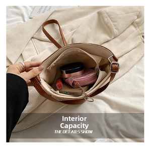 Internal view of the straw bucket bag showing large capacity for essentials and zip pocket