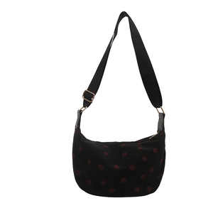 Black corduroy crescent shoulder bag with red strawberry print and adjustable strap