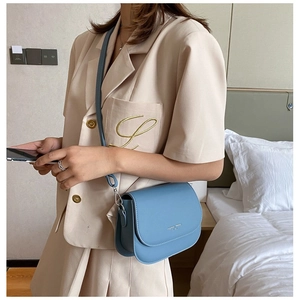 Chic foggy blue leather saddle crossbody bag with adjustable strap for women