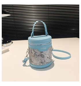 Detailed shot of light blue bucket bag with silver floral lace and jingpin logo