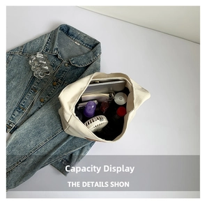 Spacious canvas tote bag interior showing capacity for tablet, fan, and skincare items