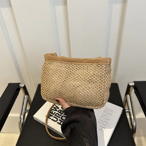 Summer woven crossbody bucket bag with tan leather trim and matching shoulder strap