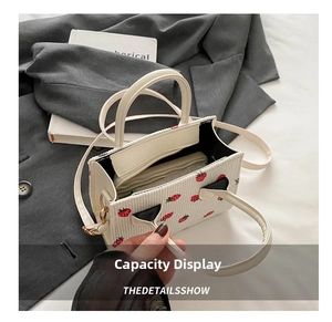 Interior view showing large capacity for a wallet in strawberry corduroy bag