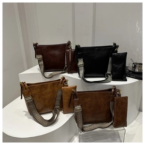 Detailed view of vintage tote bags in four colors with stylish woven wide shoulder straps
