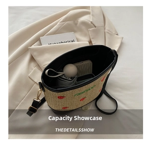 Interior view showing the large capacity of this strawberry straw bucket bag