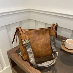 Vintage brown leather bucket bag with ethnic woven wide shoulder strap for women