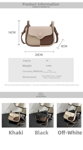 Detailed view of bicolor crossbody flap bag with 20x14x8cm dimensions and round button décor