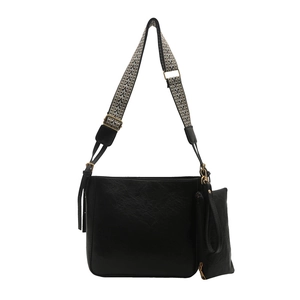 Vintage black leather tote bag with geometric woven strap and small zipper pouch