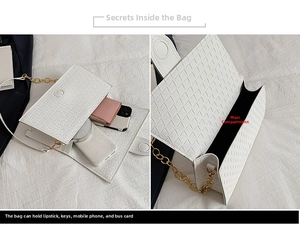 Interior view of white woven shoulder bag showing main compartment with phone and makeup