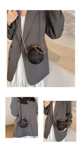 Detail of glitter sphere evening bag with gold ring handle and detachable chain strap