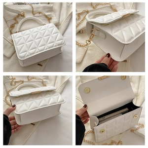 Detail of white quilted handbag with woven handle, gold chain strap and interior space