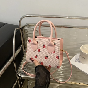 Pink corduroy crossbody bag with strawberry print and leather top handles for women