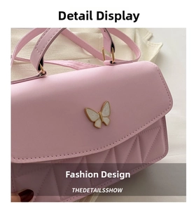 Detail of pink crossbody bag with enamel butterfly clasp and geometric quilting