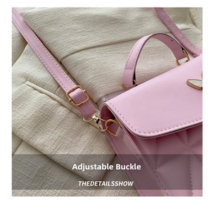 Detail shot of the adjustable metal buckle and pink quilted leather texture of the bag