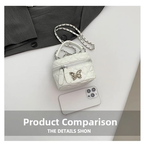 Mini white quilted box bag with silver butterfly and phone for scale comparison