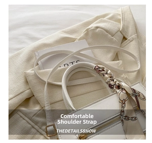 White leather tote bag with elegant silk scarf wrapped handle and slim shoulder strap