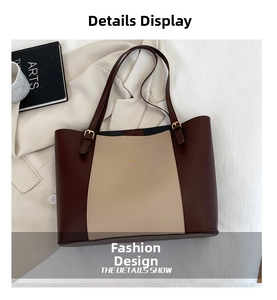 Detail show of minimalist contrast-color PU tote bag with gold metal hardware buckles