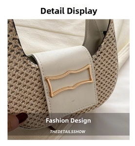 Detail of woven crescent shoulder bag with white leather trim and gold geometric clasp