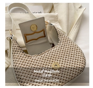 Detail of the cream woven saddle bag featuring a gold magnetic snap closure and inner flap