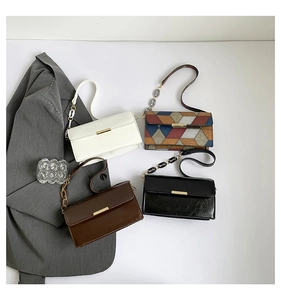 Flat lay of multiple stylish crossbody bags in white, brown, black and color-block PU leather