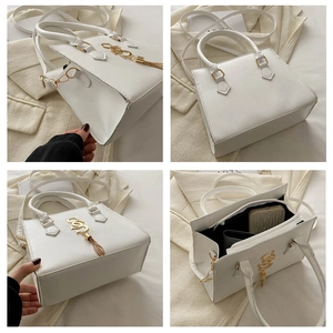 Detailed views of a white minimalist handbag with gold SS logo and tassel accents