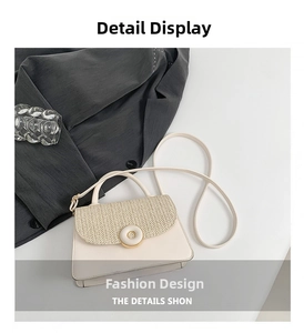 Detail of minimalist beige crossbody bag featuring V-shaped woven texture and golden ring buckle