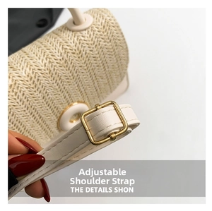 Detail of adjustable leather strap and herringbone weave on a beige straw crossbody bag