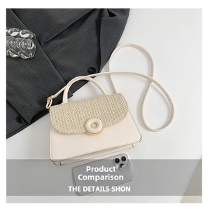 Detail of straw woven patchwork handbag featuring a gold buckle and adjustable strap