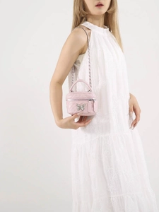 Pink quilted mini crossbody box bag with silver chain strap and butterfly clasp